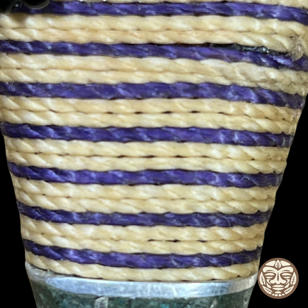 Close-up of kuripe with alternating horizontal stripes of natural tan purple chambira rope.