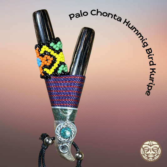 Handmade hummingbird Palo Chonta Kuripe pendant with black wooden bodies, beaded accents, and turquoise tip.